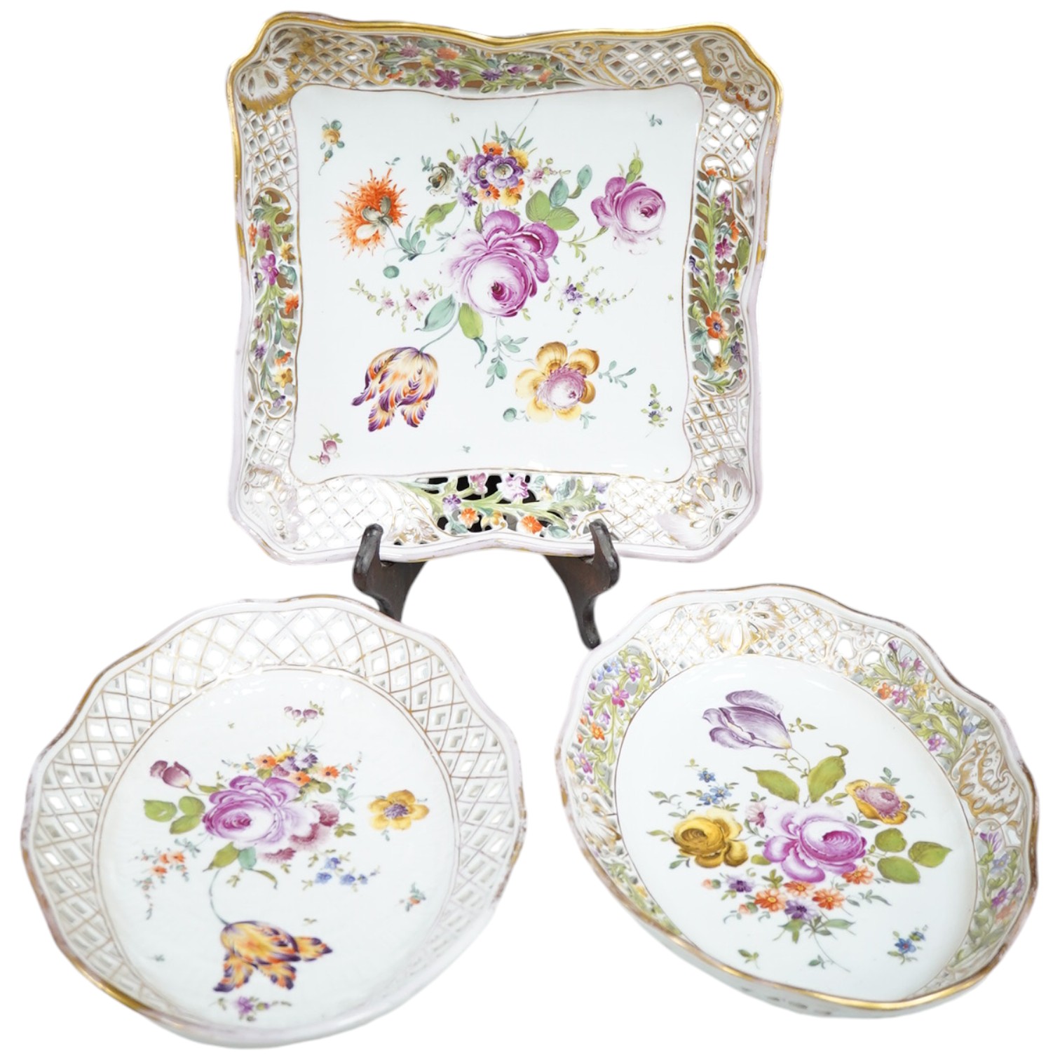 Three Potschappel flower painted reticulated dishes, largest 24.5 x 24.5cm. Condition - fair to good